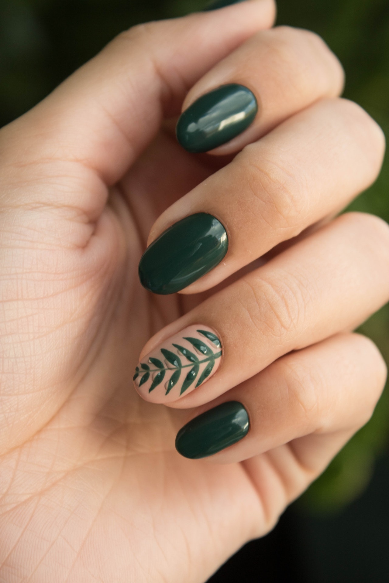 Hand with the Green Beauty Nails