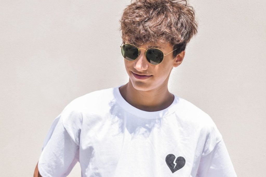 boy-wearing-a-white-t-shirt-and-black-sun-glasses