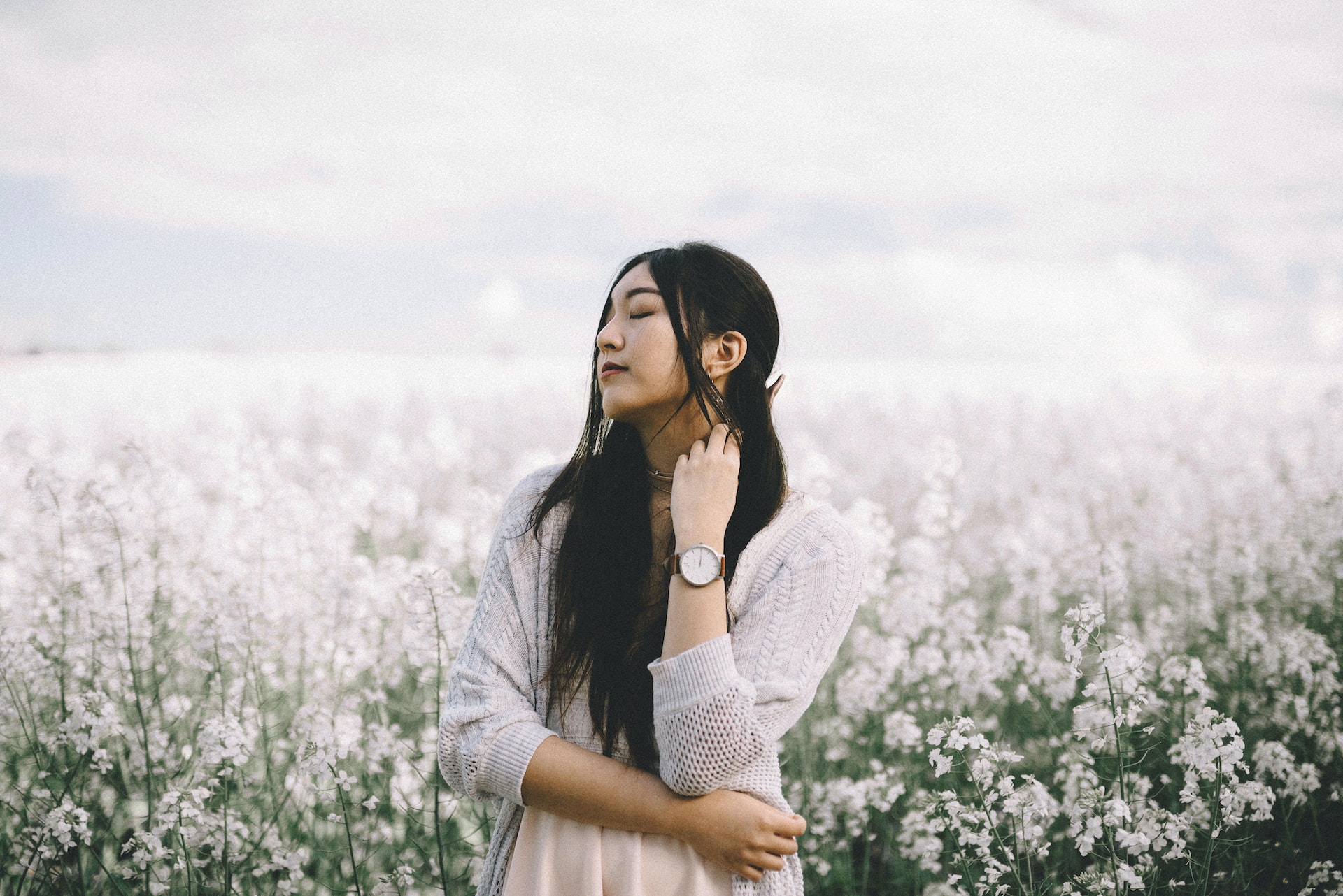 South korean girl in the garden of white flowers