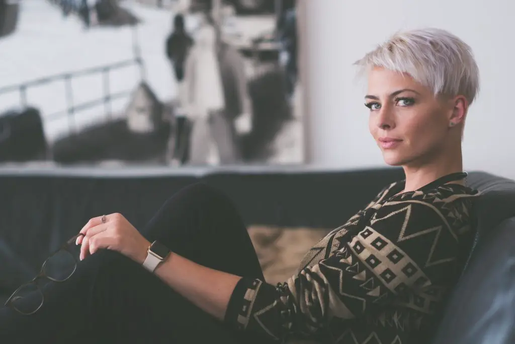 beautiful german woman sitting at sofa