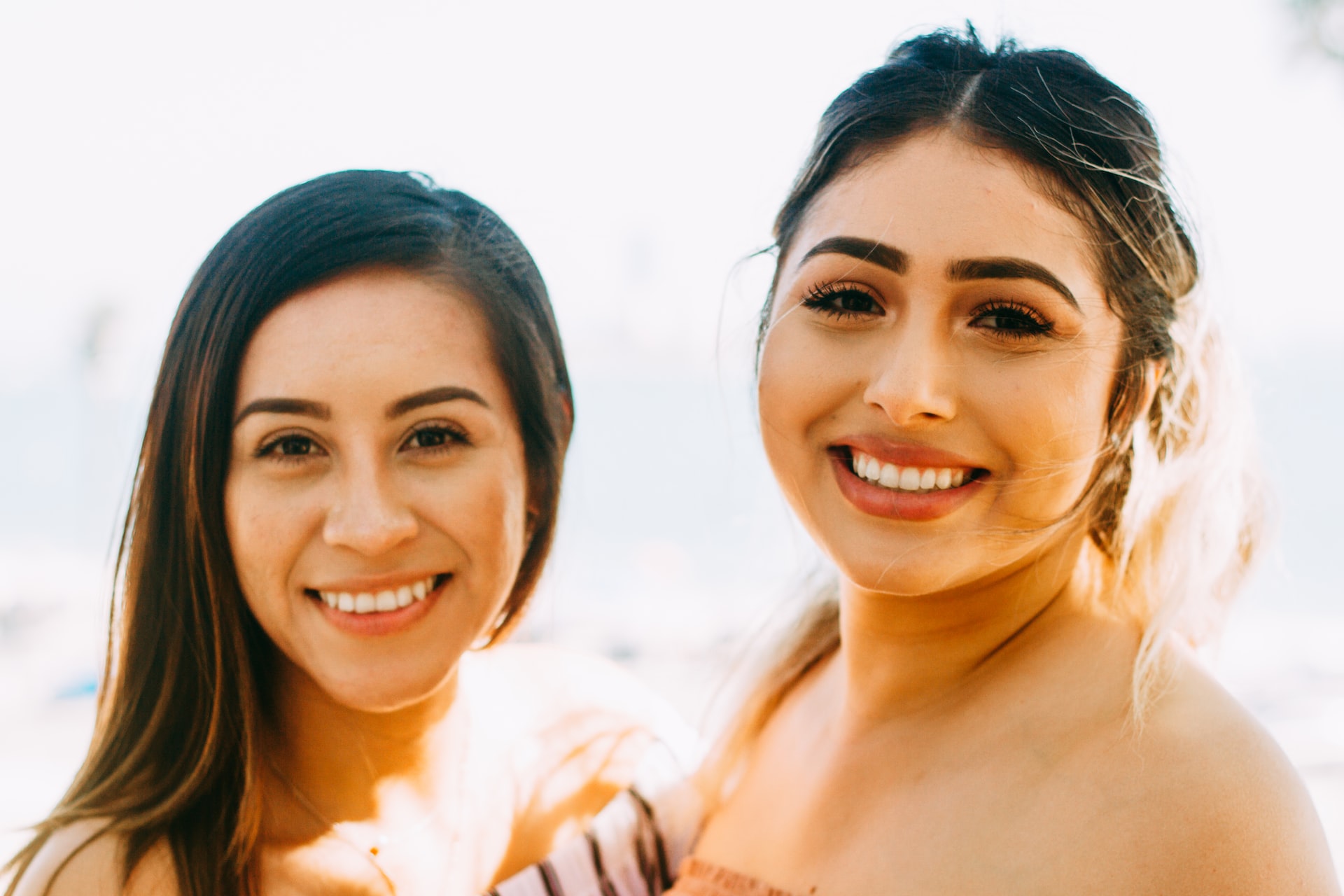 2 mexican women are smiling