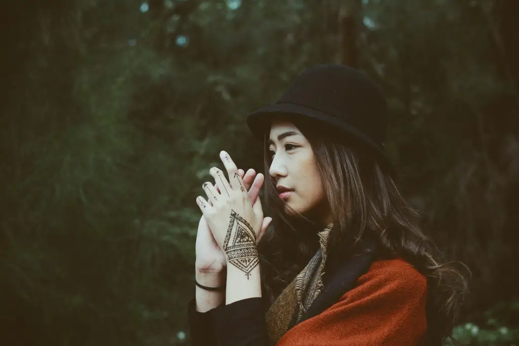 Vietnam Girl wearing black hat and red top