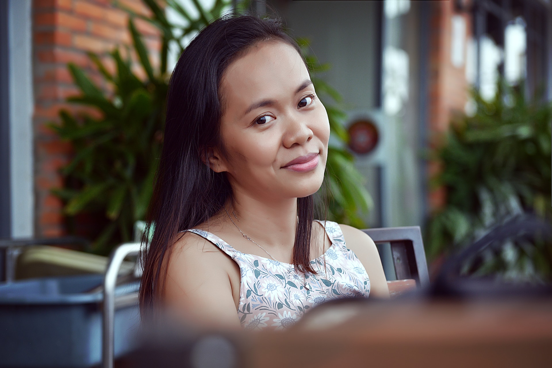 beautiful Cambodian woman smiling and wearing white top