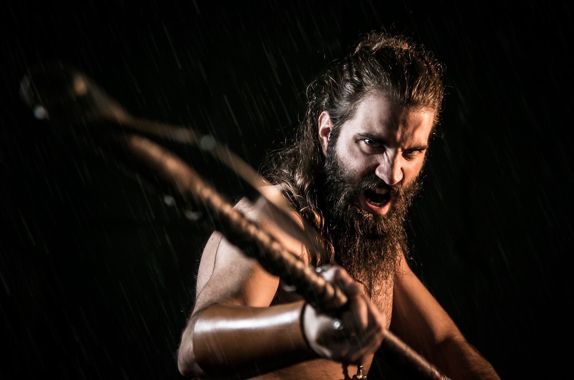 Vikings man in beard has AXE in hand