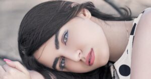 Girl is showing snail mucin benefits on her skin